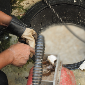 How do enzyme cleaners work in grease traps?